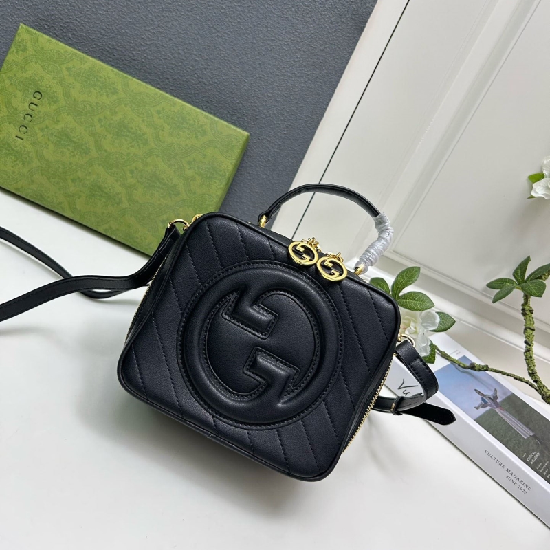 G*u*i top handle bags